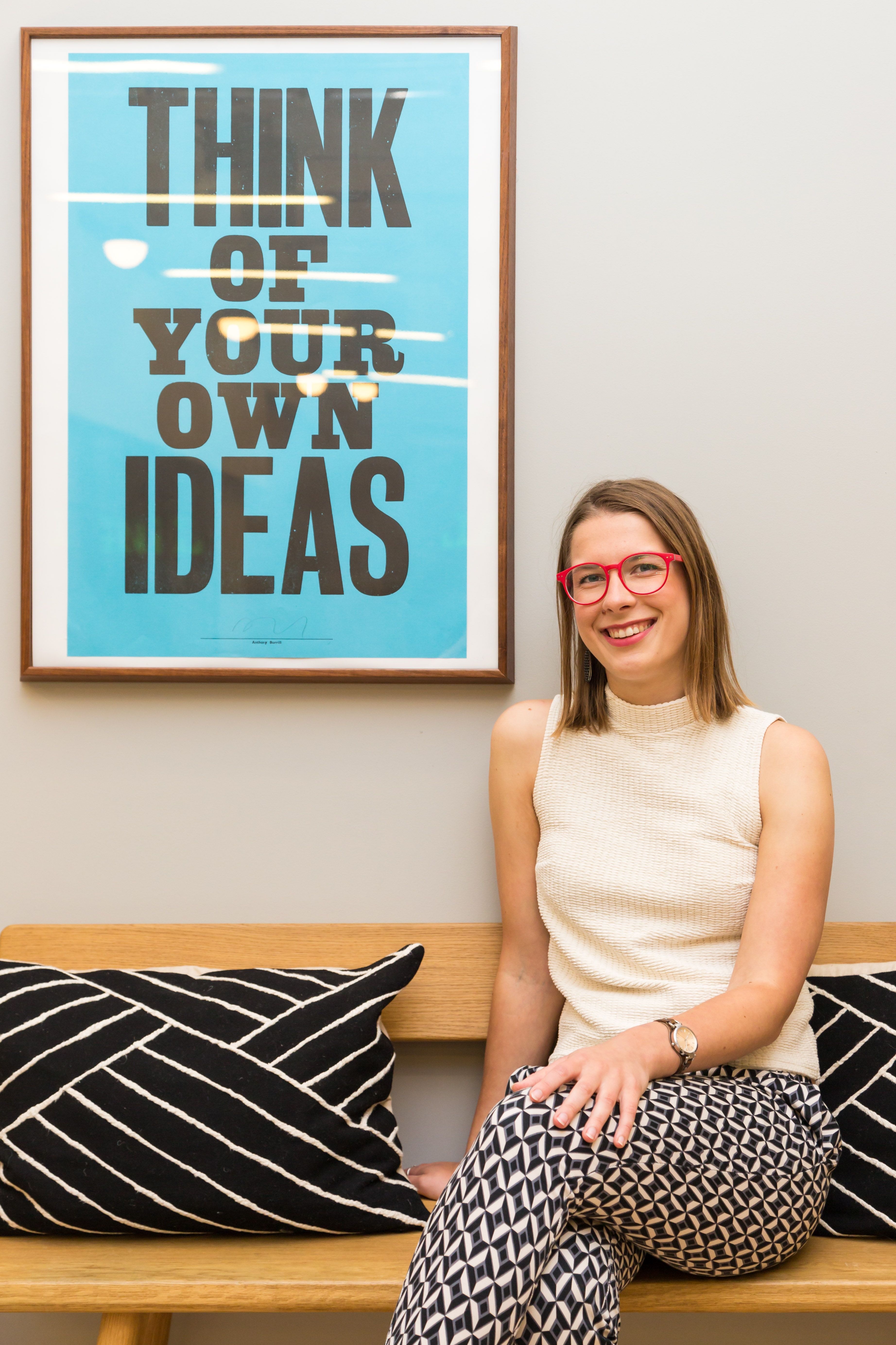 Solveiga sitting on a bench